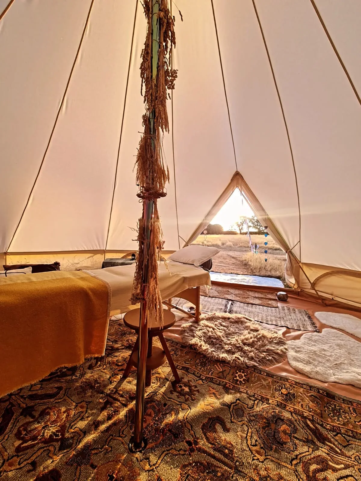 Massage table prepared inside the canvas bell tent